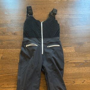 Elegant Black Quilted Jumpsuit with Zipper Accents